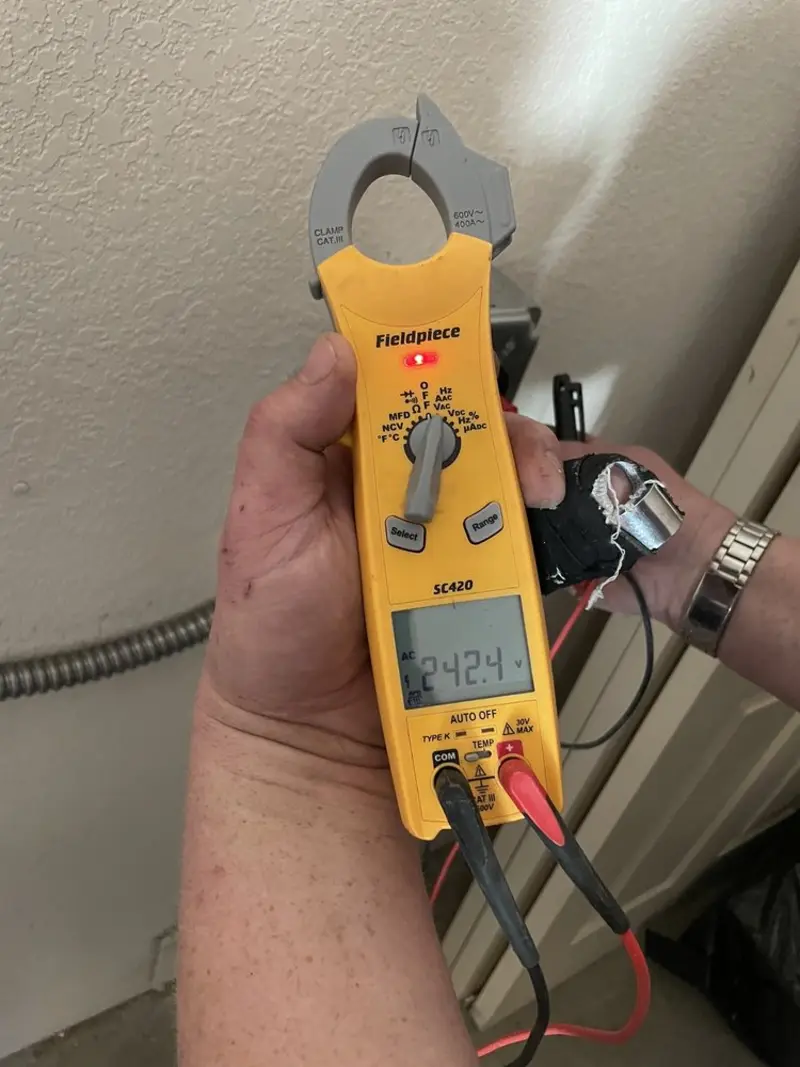 Voltage testing with clamp meter during Electrical Installation Services in Hopewell